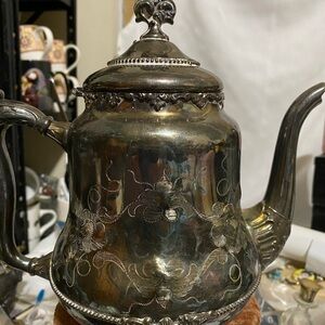 Elegant Silver Teapot with Floral Design
